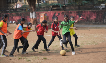 Girls playing football